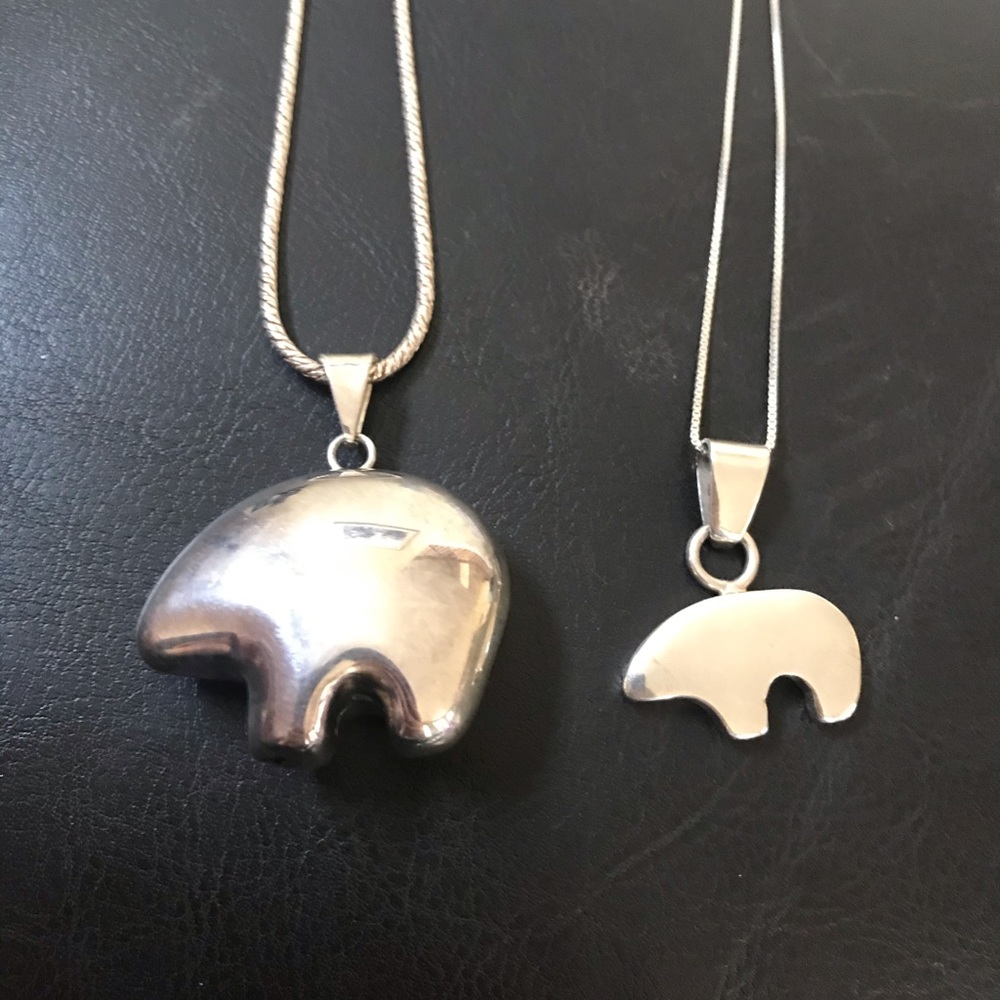 2 silver necklaces.